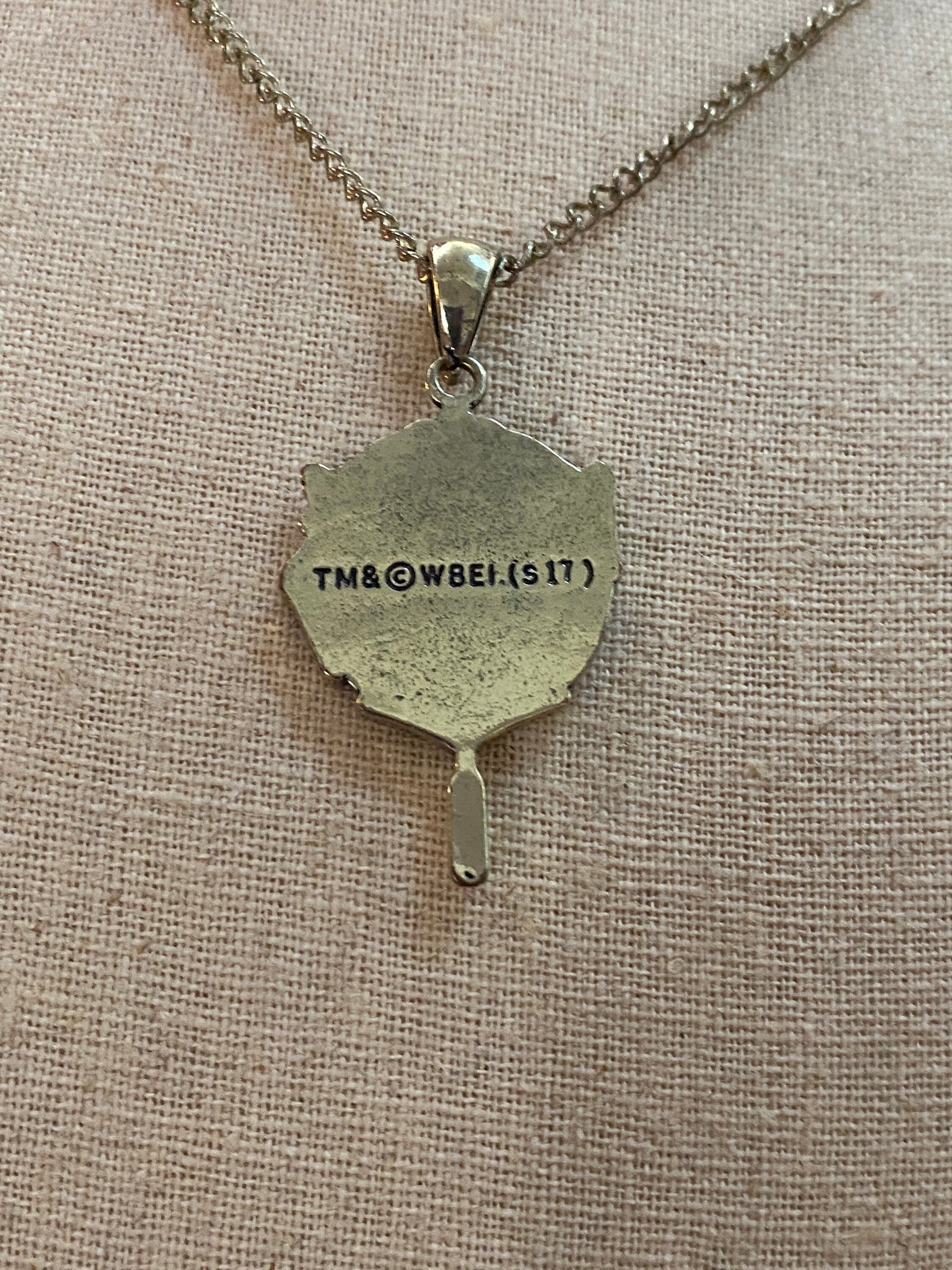 Head Girl pendant on black necklace