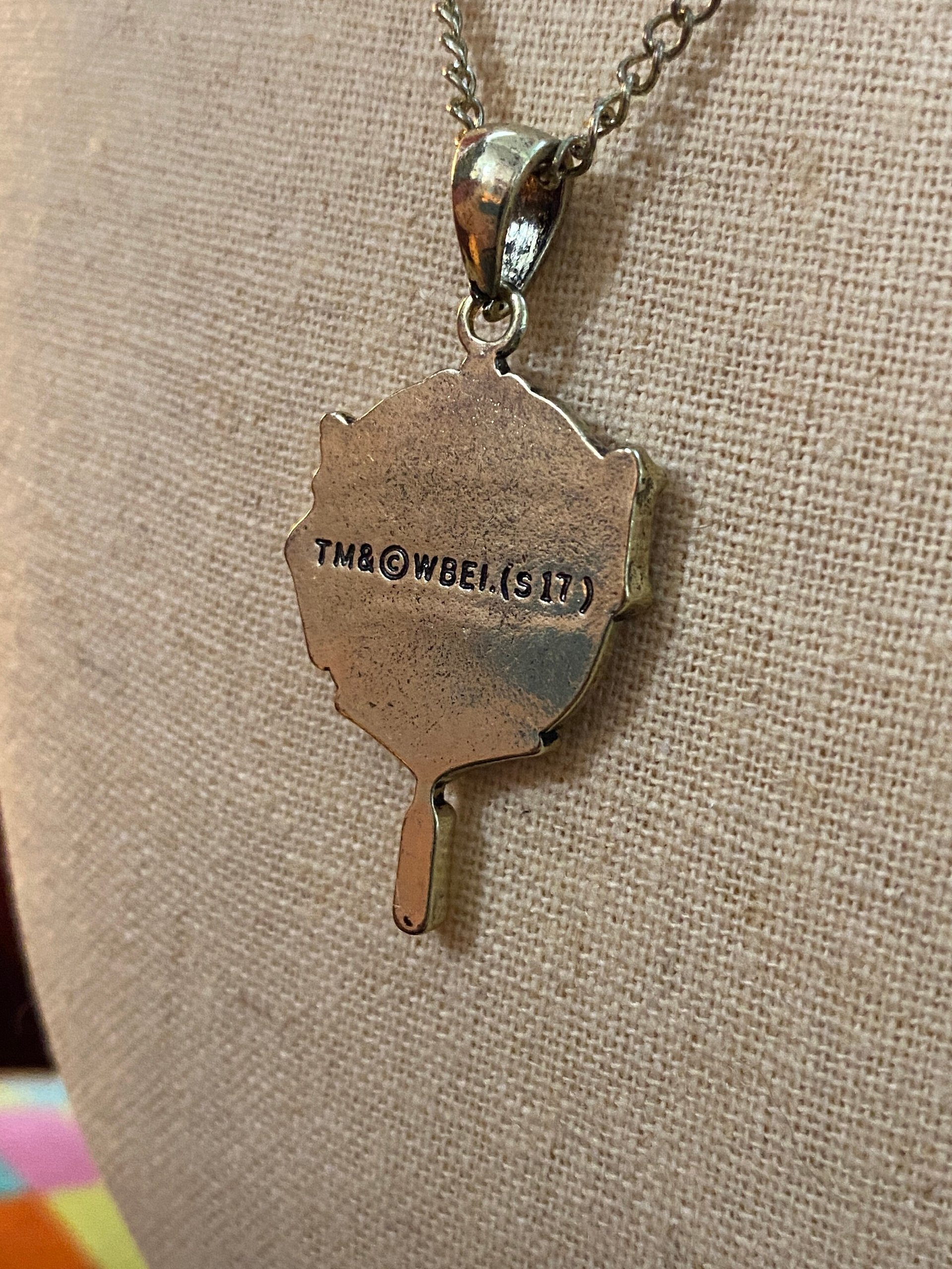 Head Girl pendant on black necklace