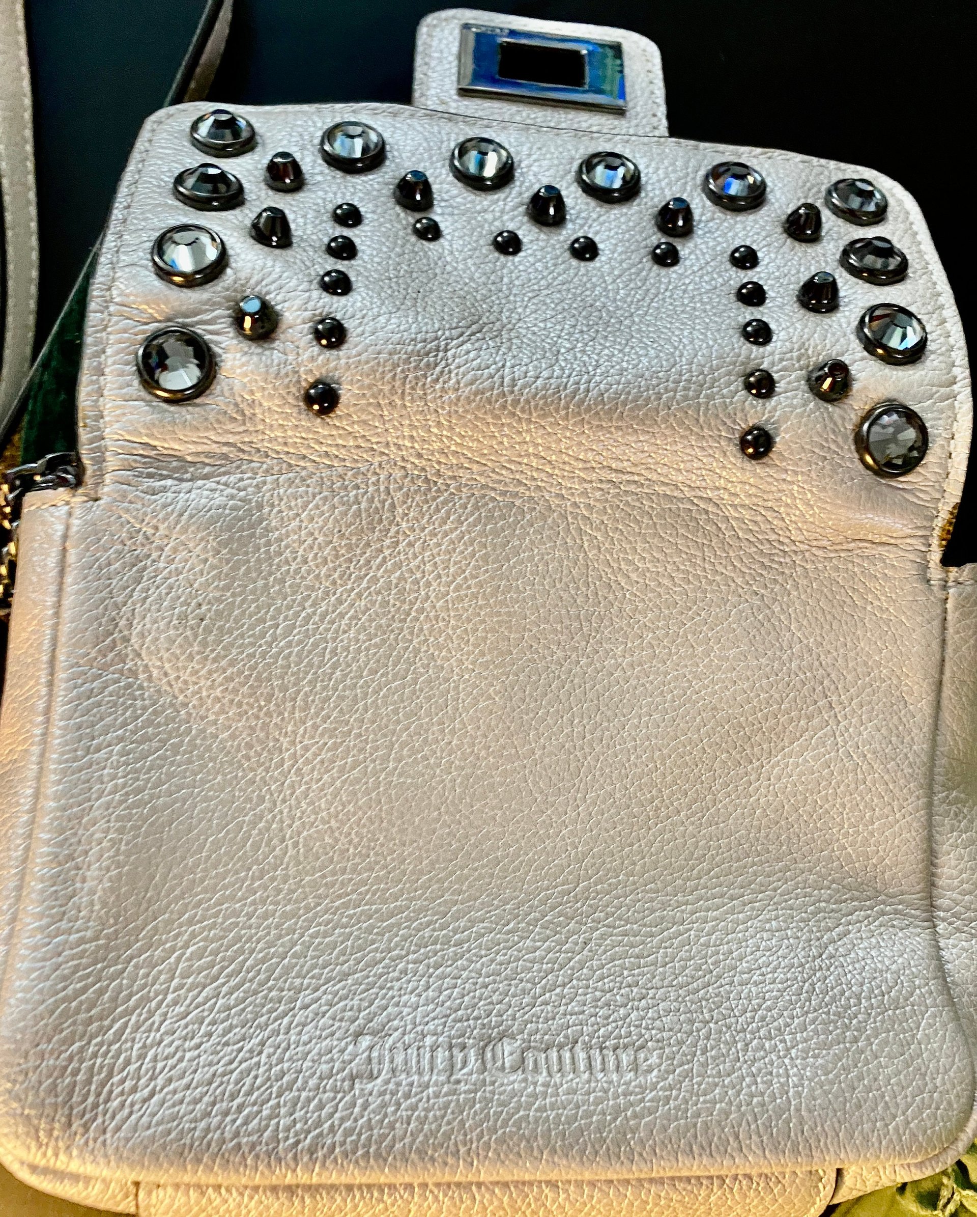 Bejeweled  Juicy Couture white with silver tone chain and dark stone