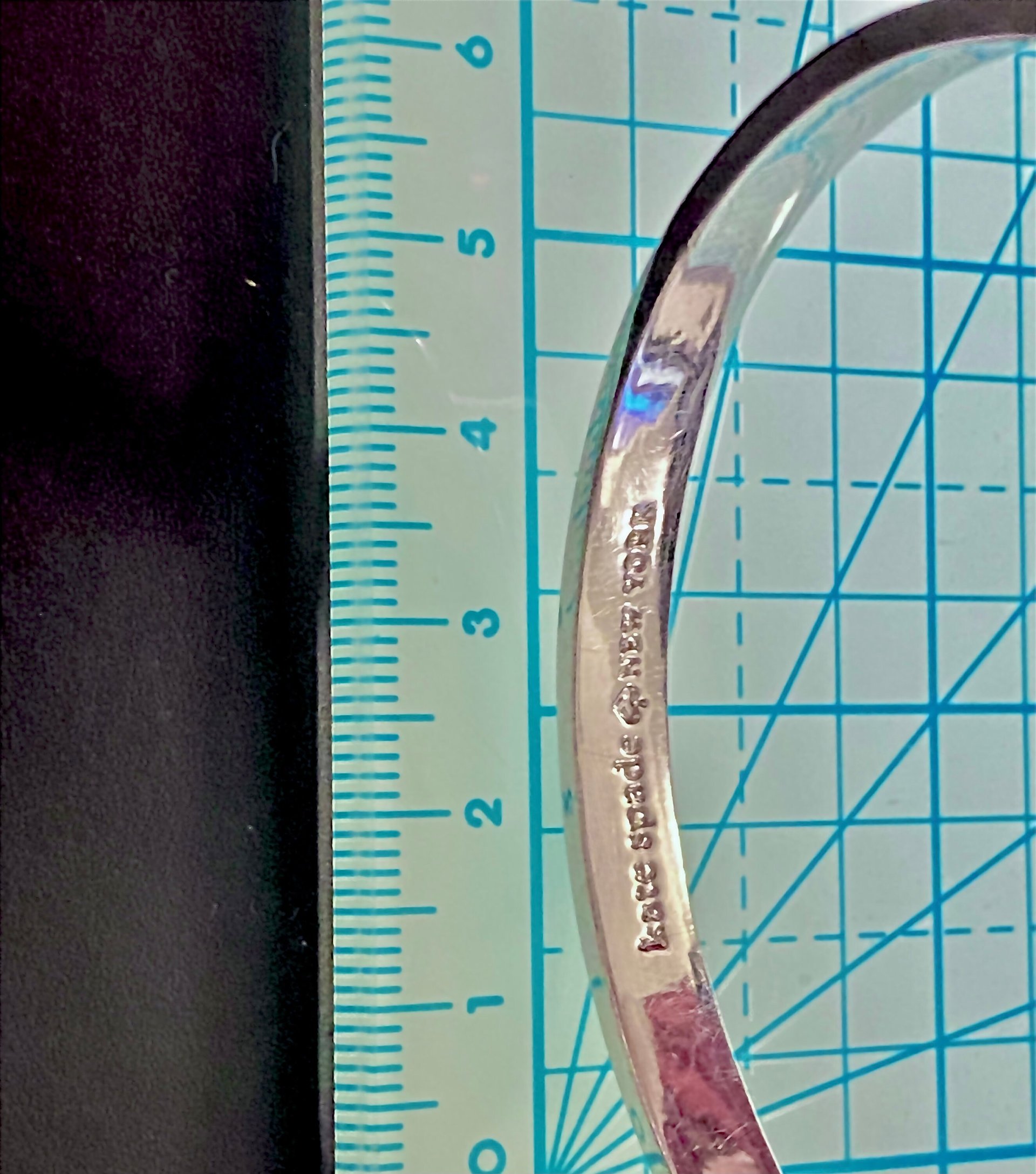 Silver tone Kate Spade “Take a Bow” bangle bracelet