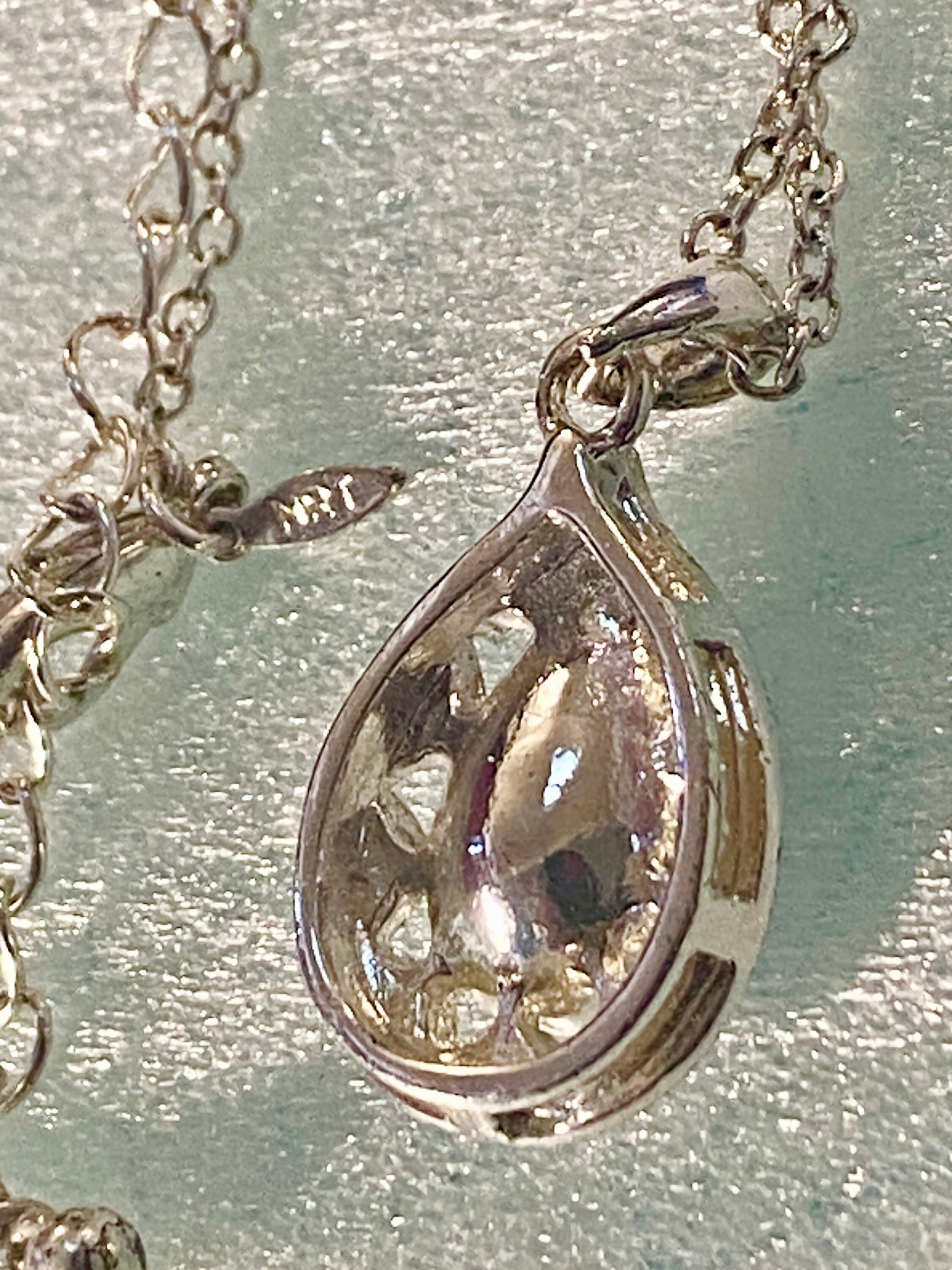 Vintage blue teardrop crystal halo NRT signed pendant on a silver chain with matching dangle earrings.