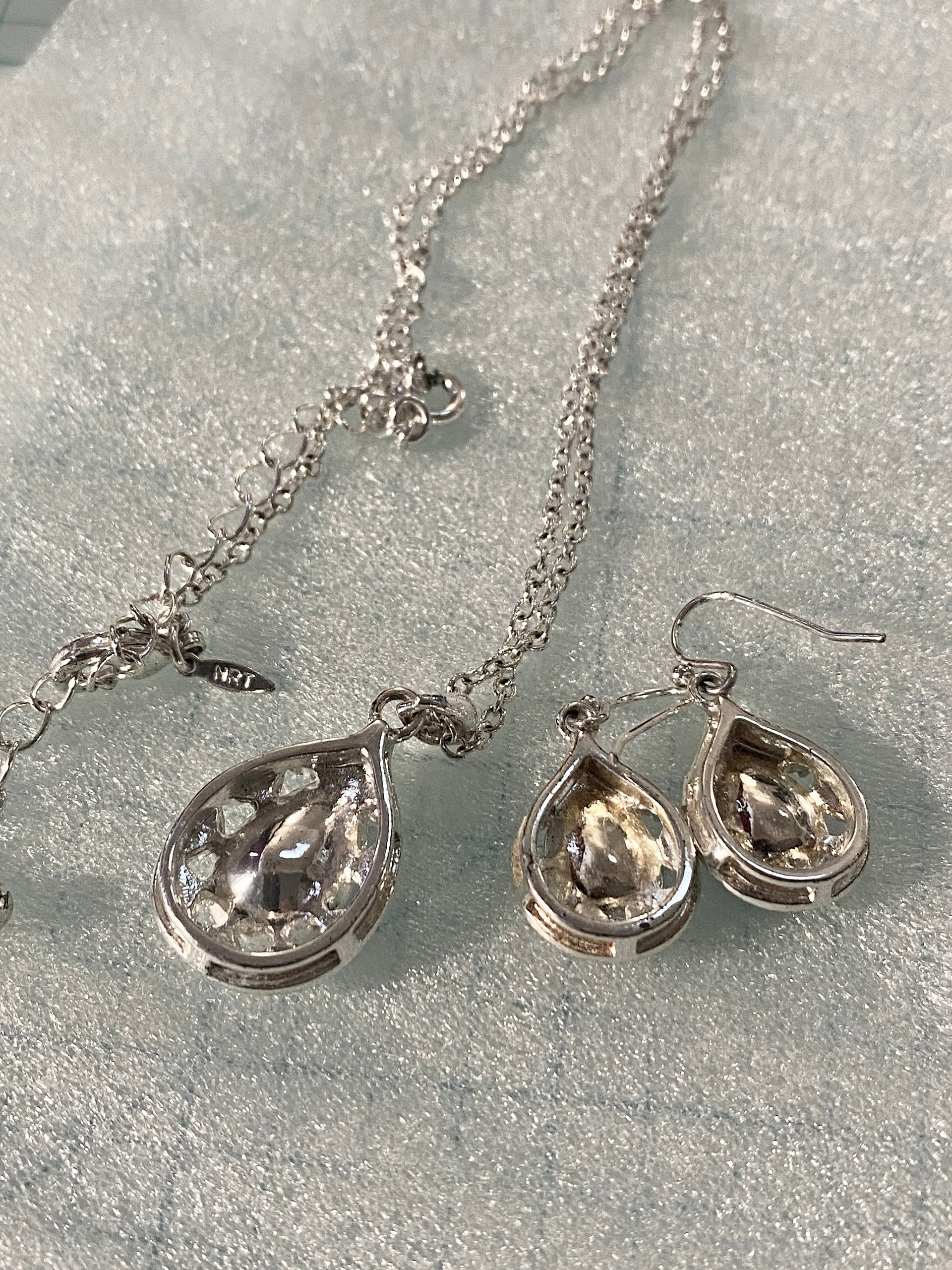 Vintage blue teardrop crystal halo NRT signed pendant on a silver chain with matching dangle earrings.