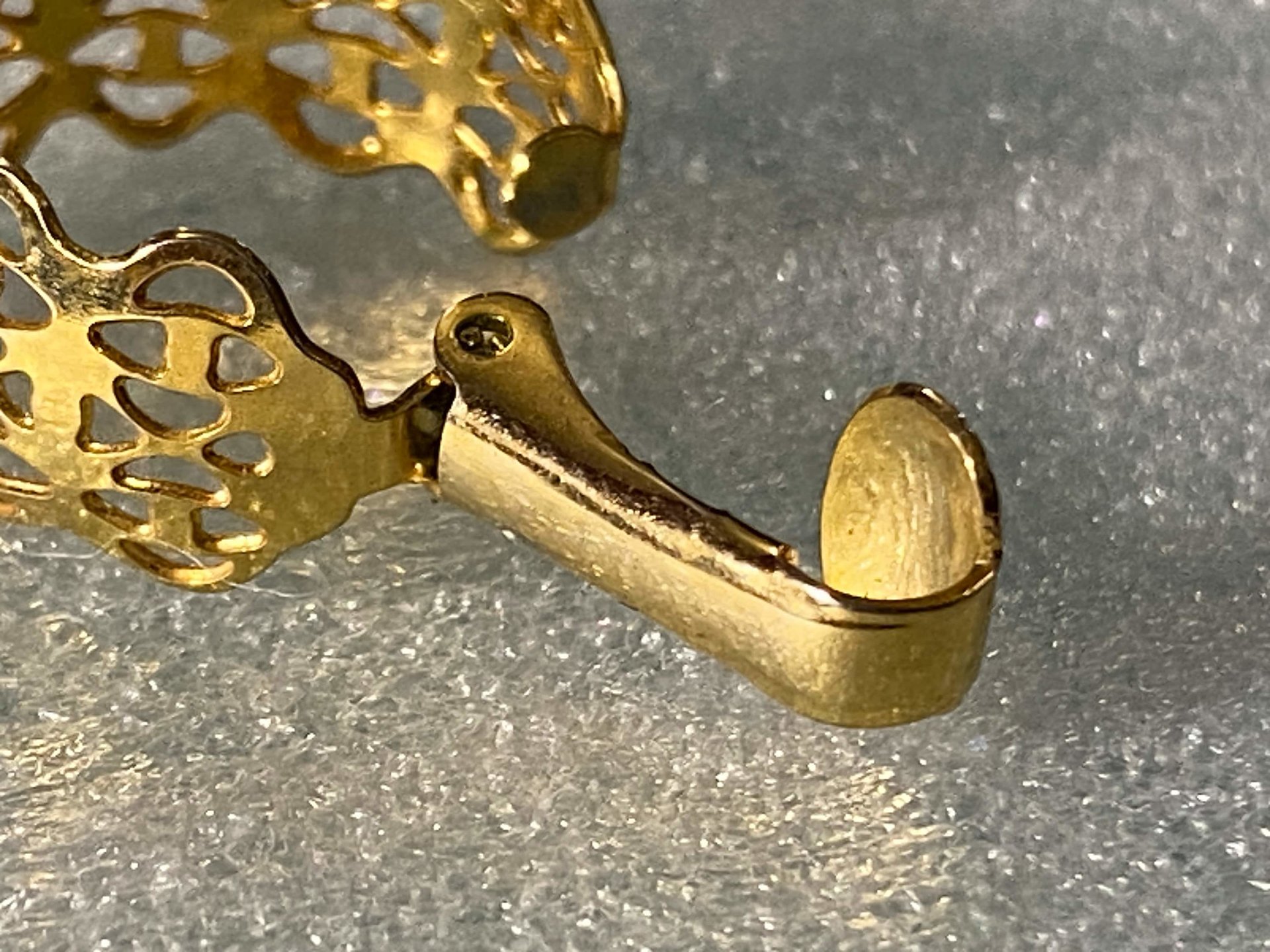 Gold tone thick Art Nouveau love scroll hoop earrings
