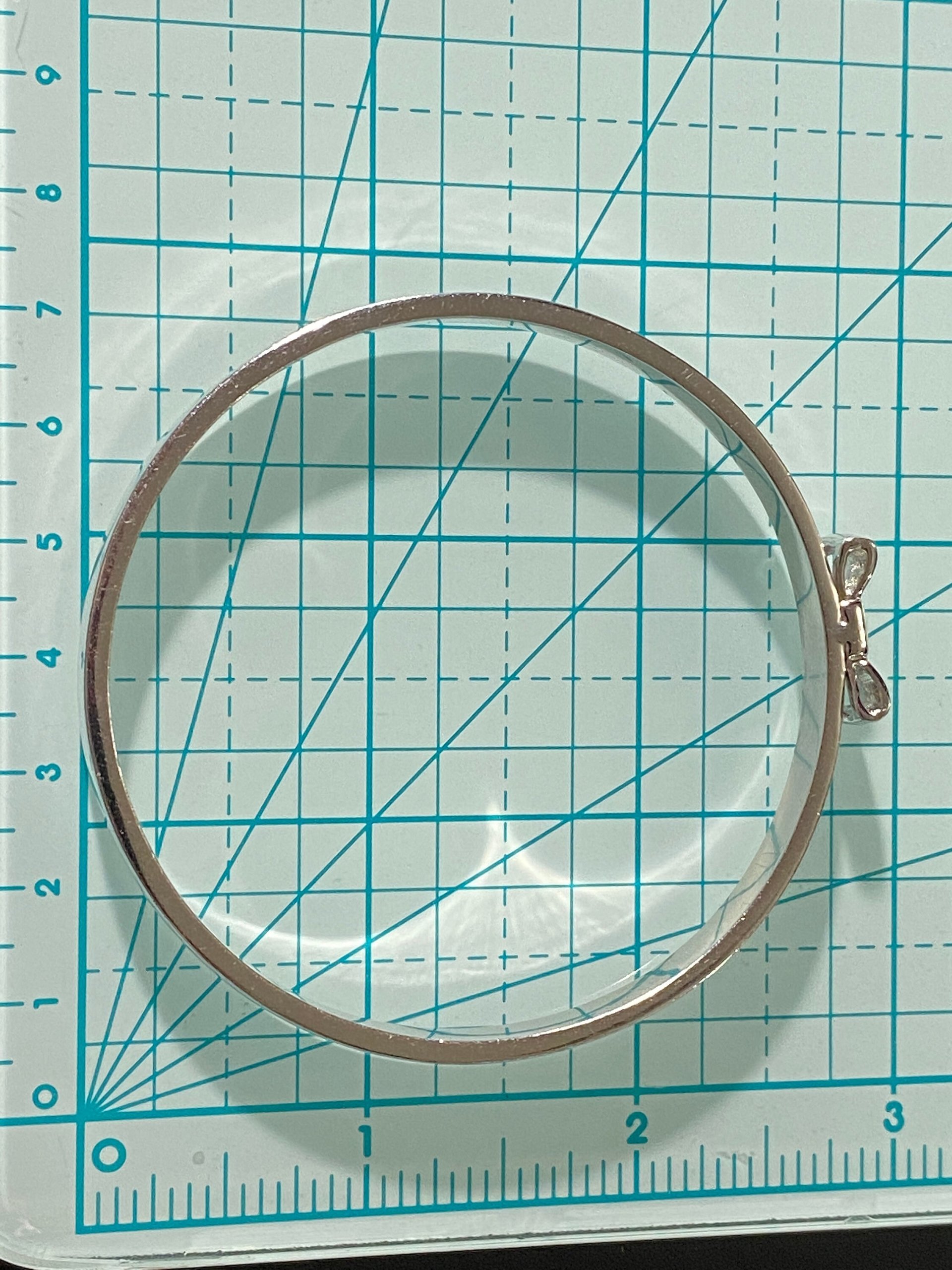 Silver tone Kate Spade “Take a Bow” bangle bracelet