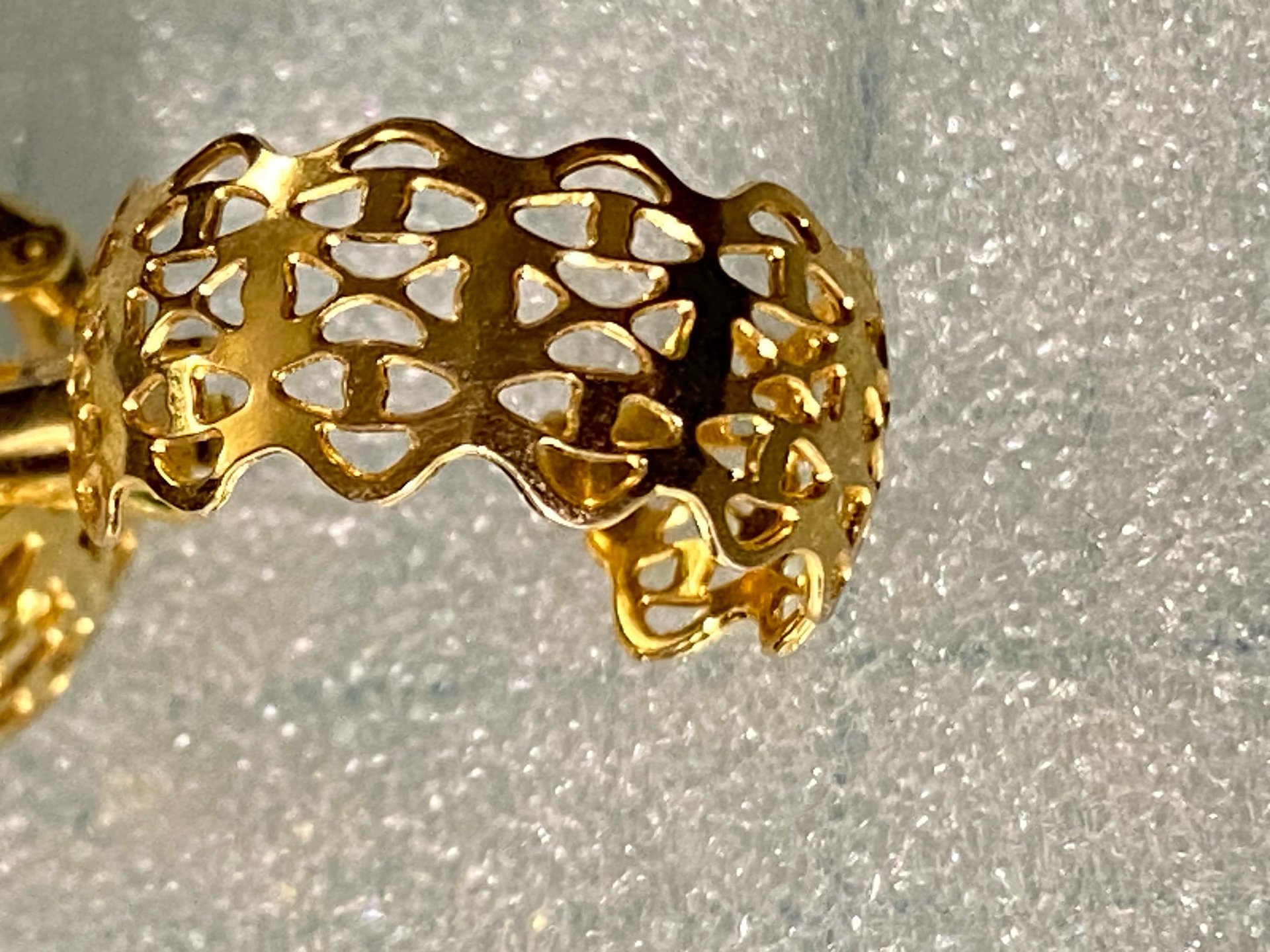 Gold tone thick Art Nouveau love scroll hoop earrings
