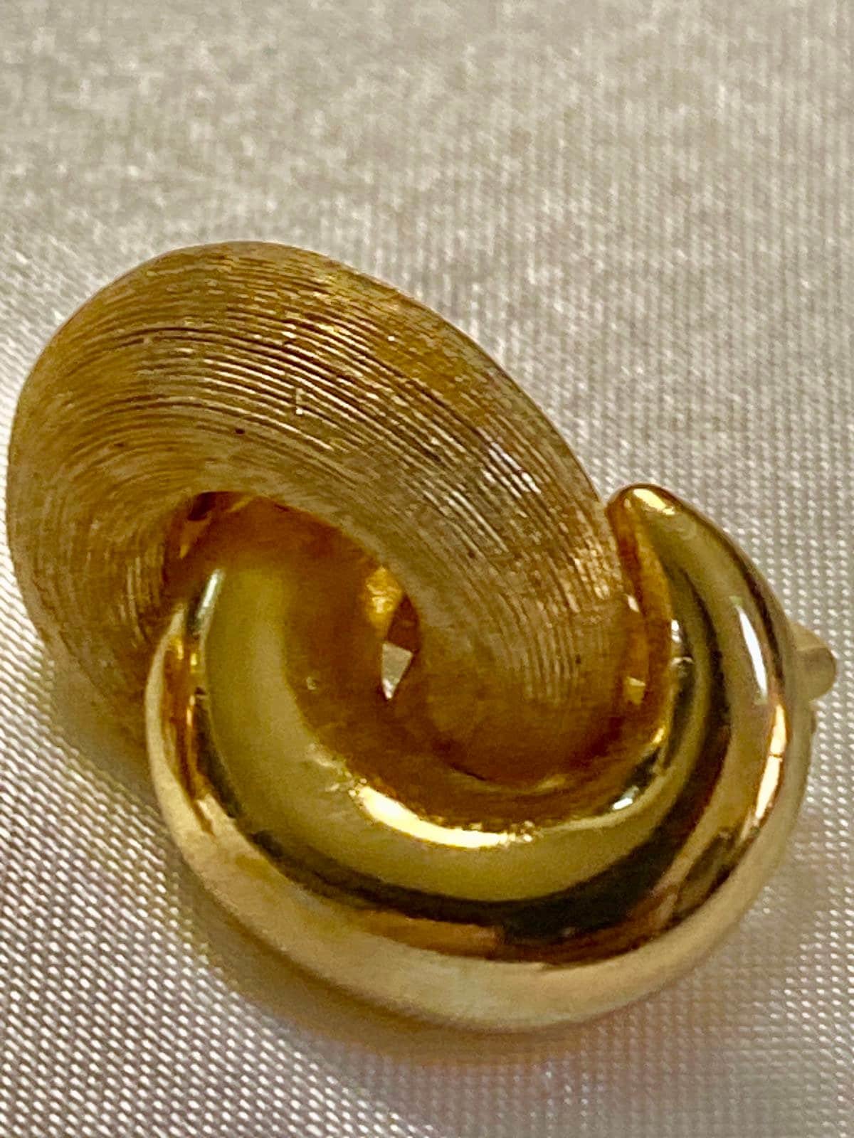 Vintage Gold tone 1980s Christian Dior high polished and textured clip on earrings.