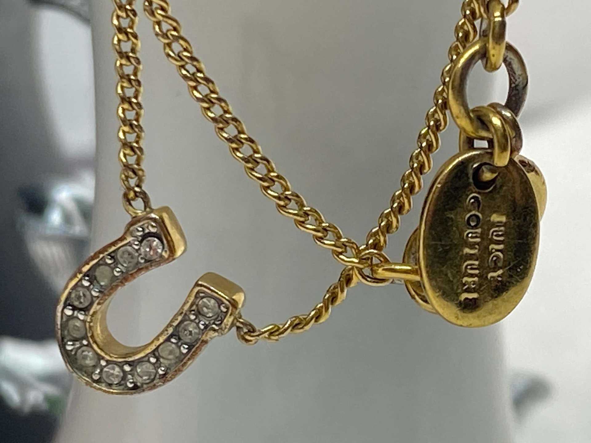 Rare authentic gold tone sparkly horseshoe  signed Juicy Couture