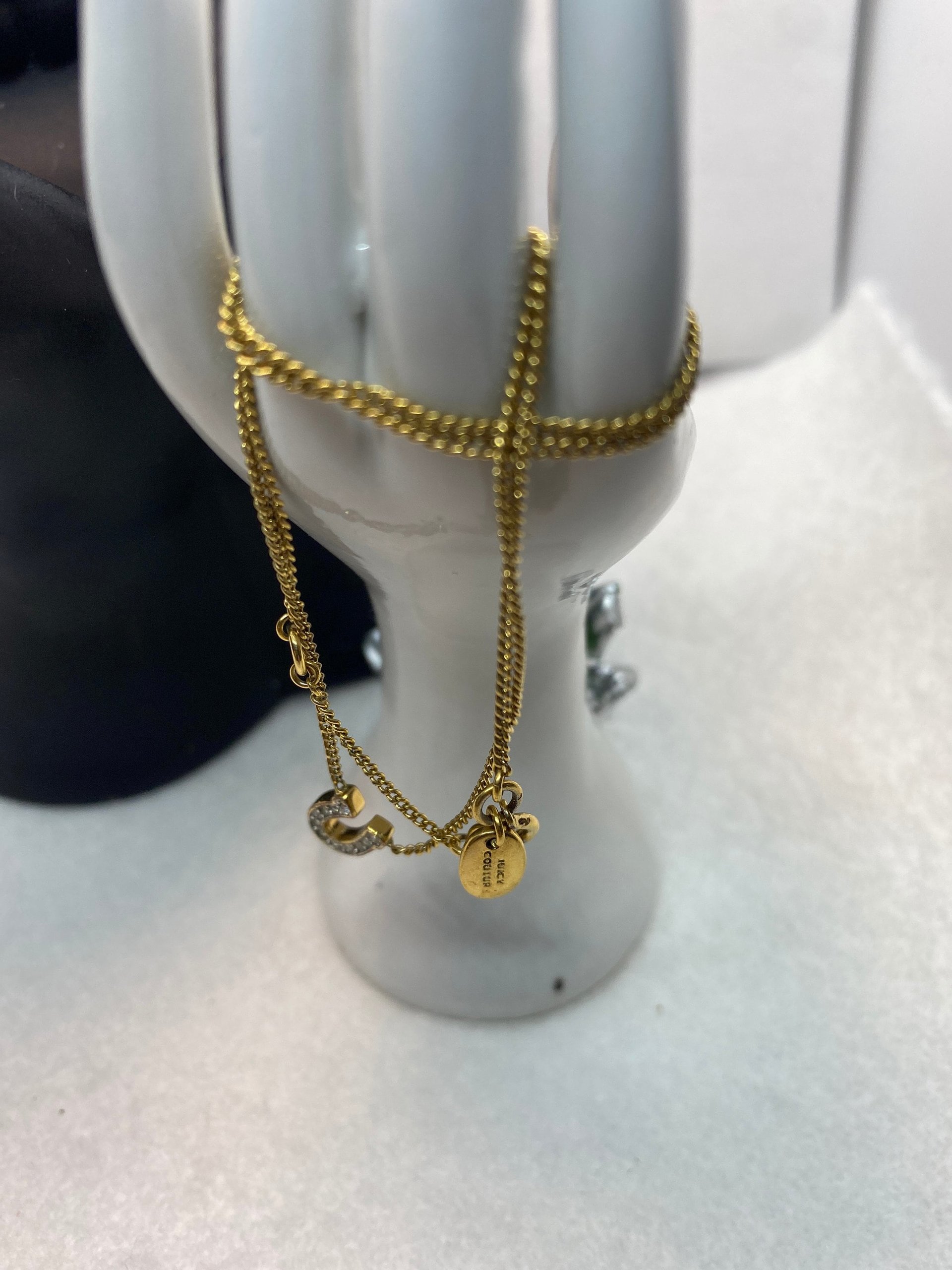 Rare authentic gold tone sparkly horseshoe  signed Juicy Couture