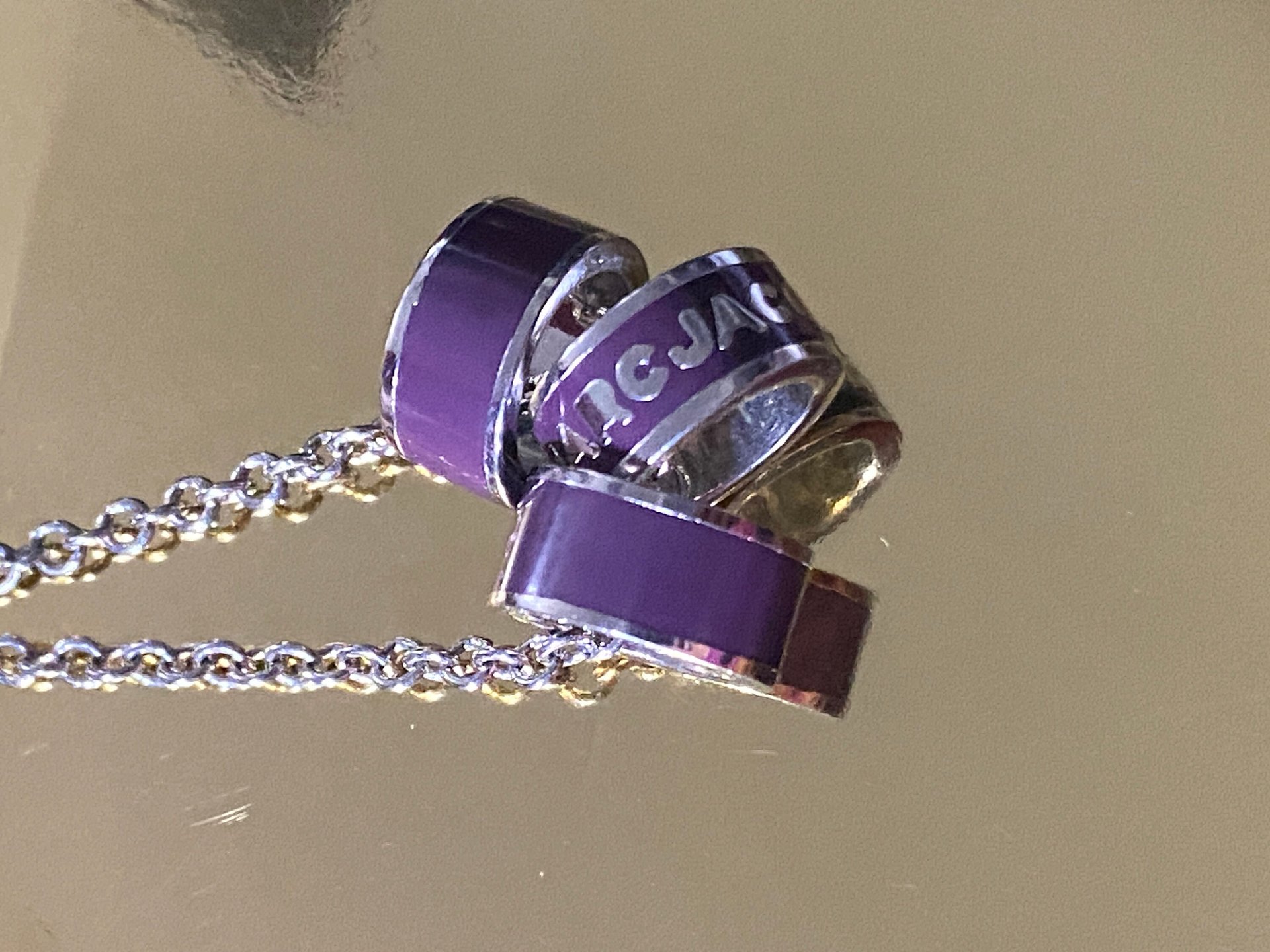 Marc By Marc Jacob - Purple metal ring as pendants on a long silver tone chain necklace