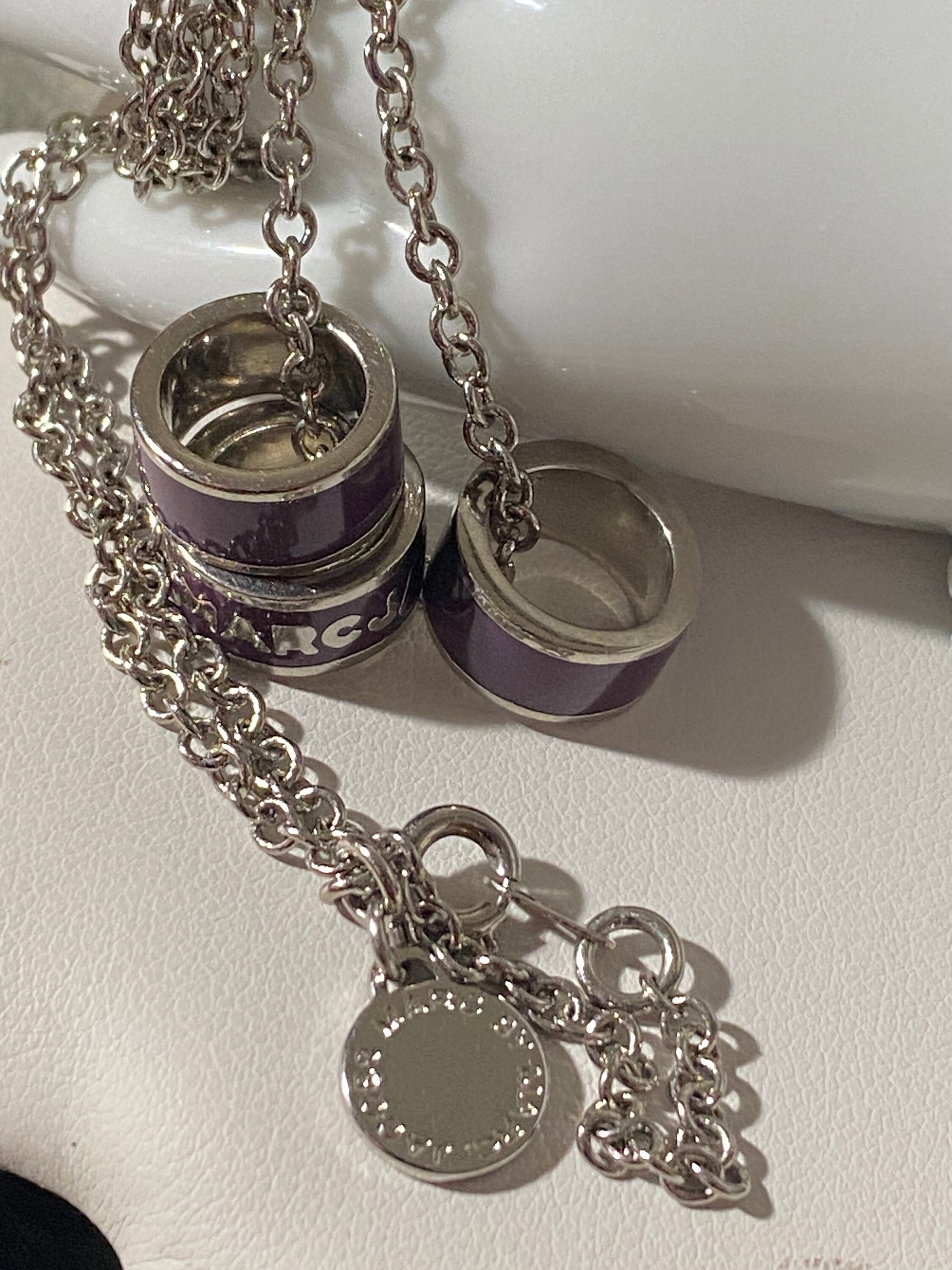 Marc By Marc Jacob - Purple metal ring as pendants on a long silver tone chain necklace