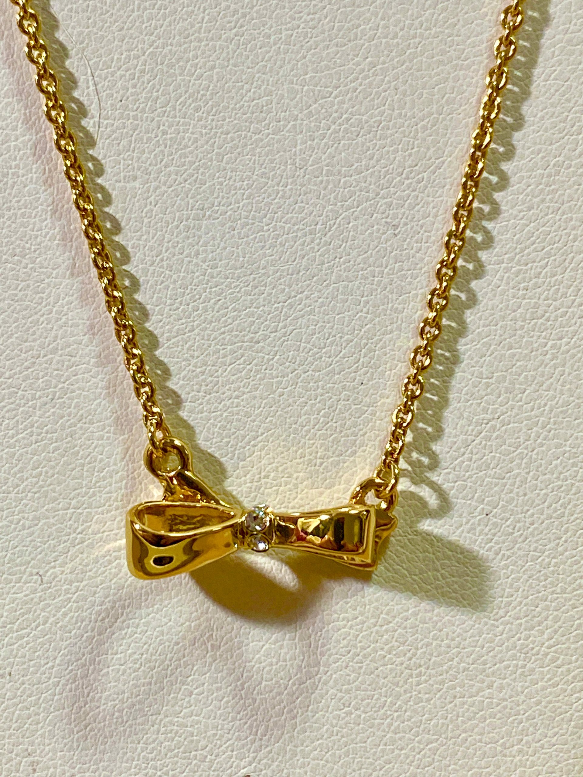 Kate Spade signed gold tone Bow pendant necklace
