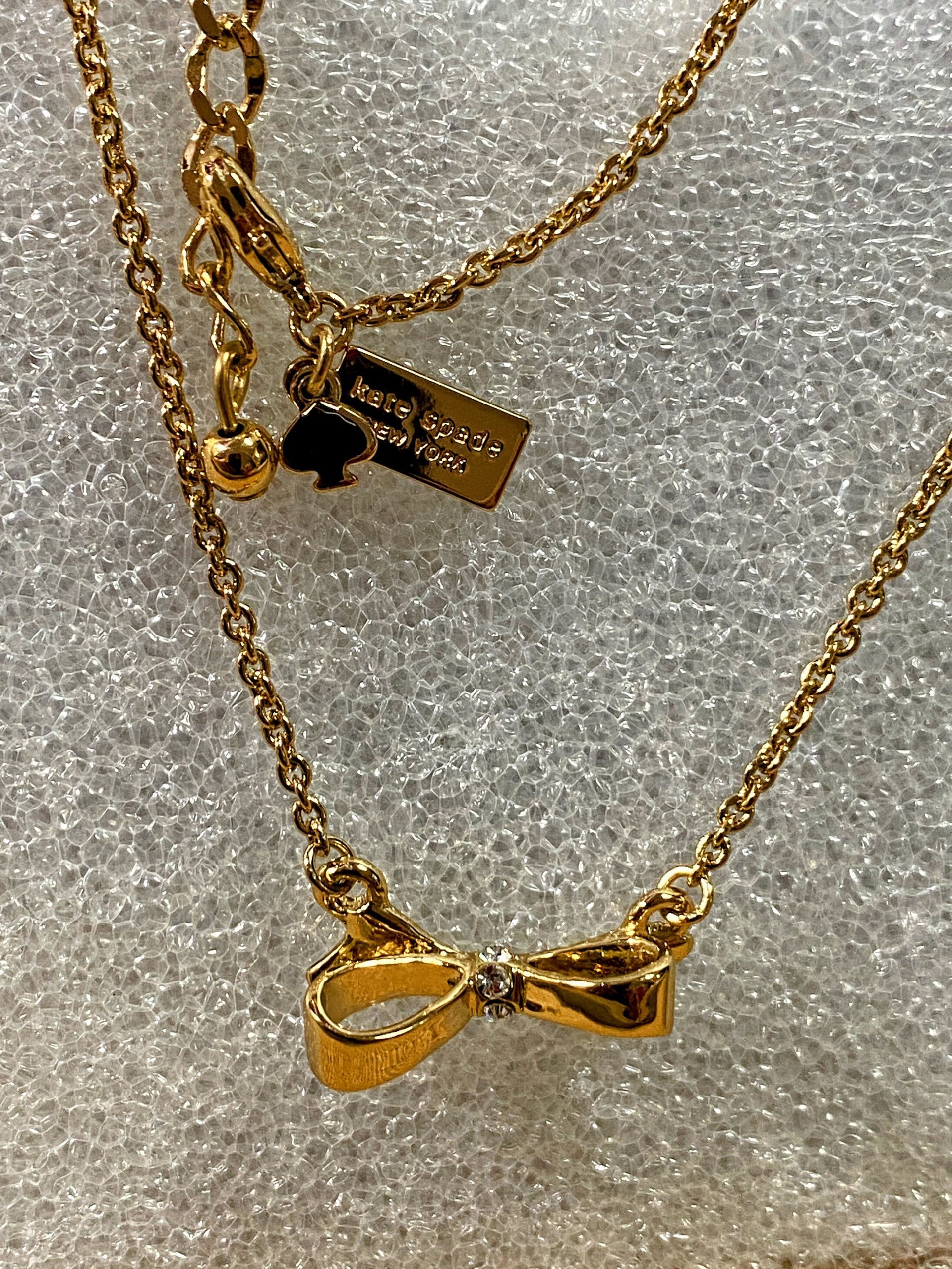 Kate Spade signed gold tone Bow pendant necklace