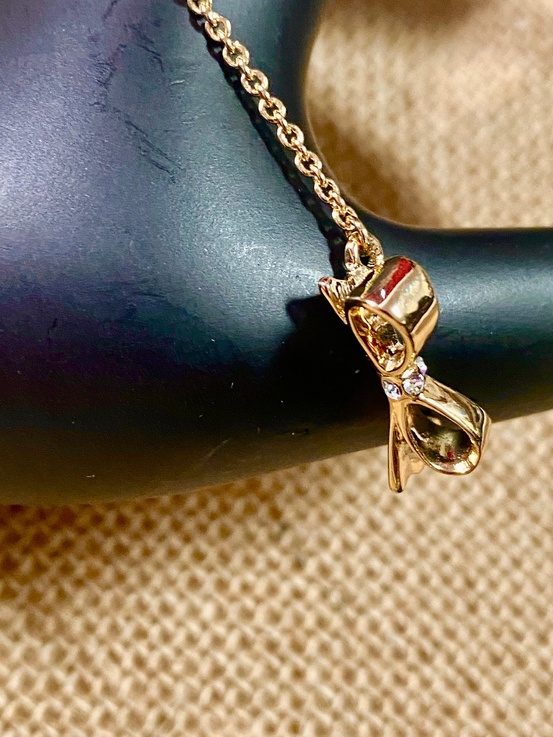 Kate Spade signed gold tone Bow pendant necklace