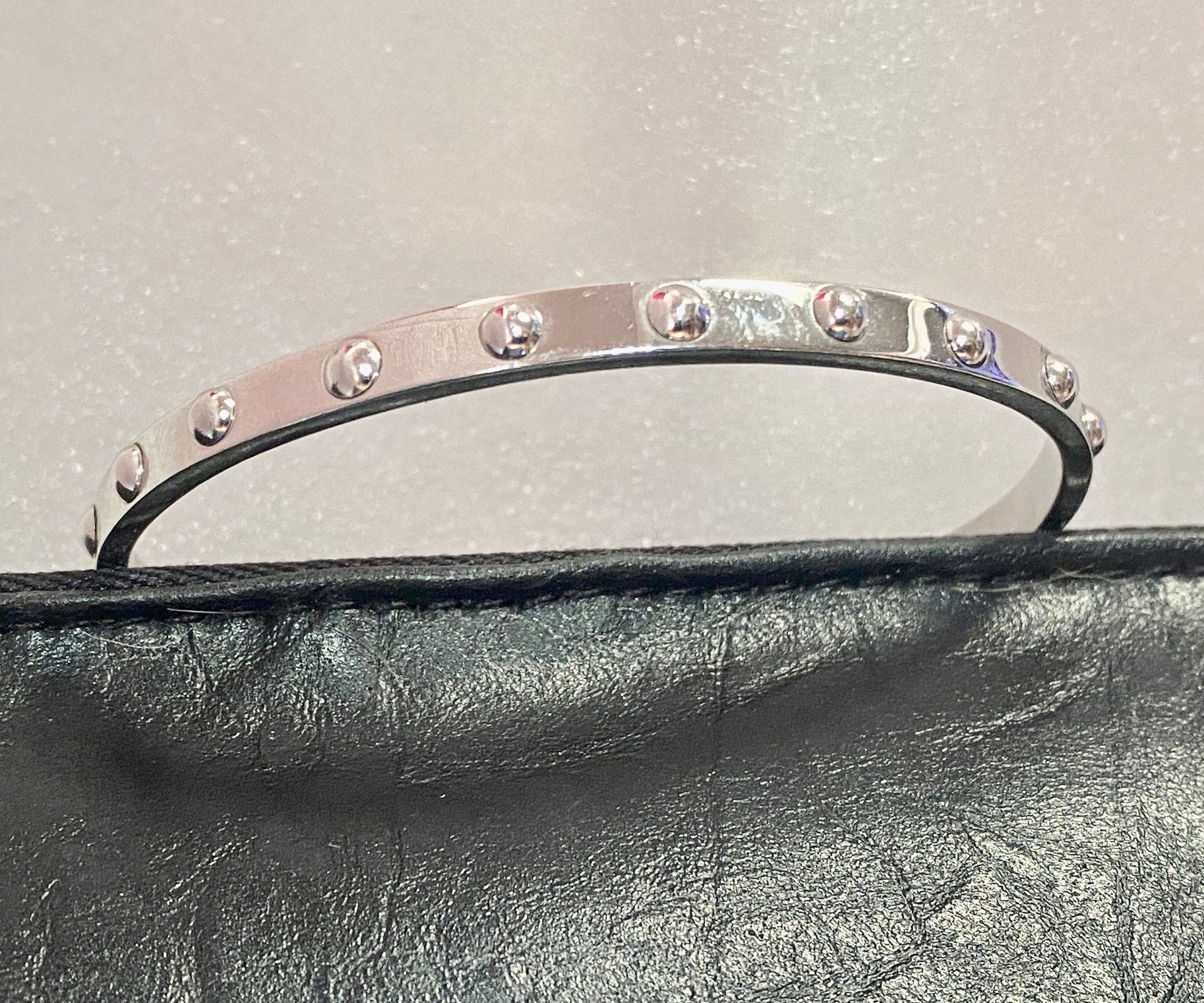 Kate Spade Silver tone studded bangle
