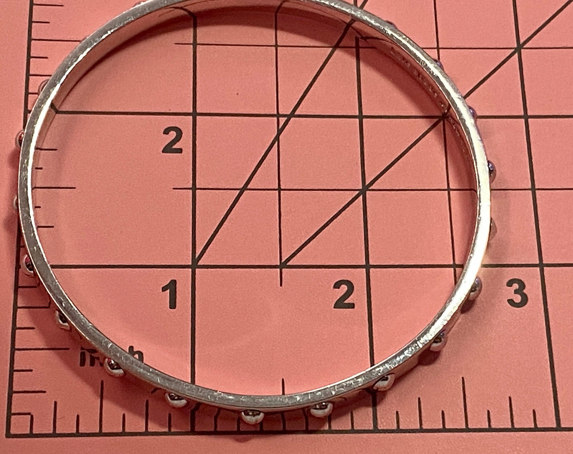 Kate Spade Silver tone studded bangle