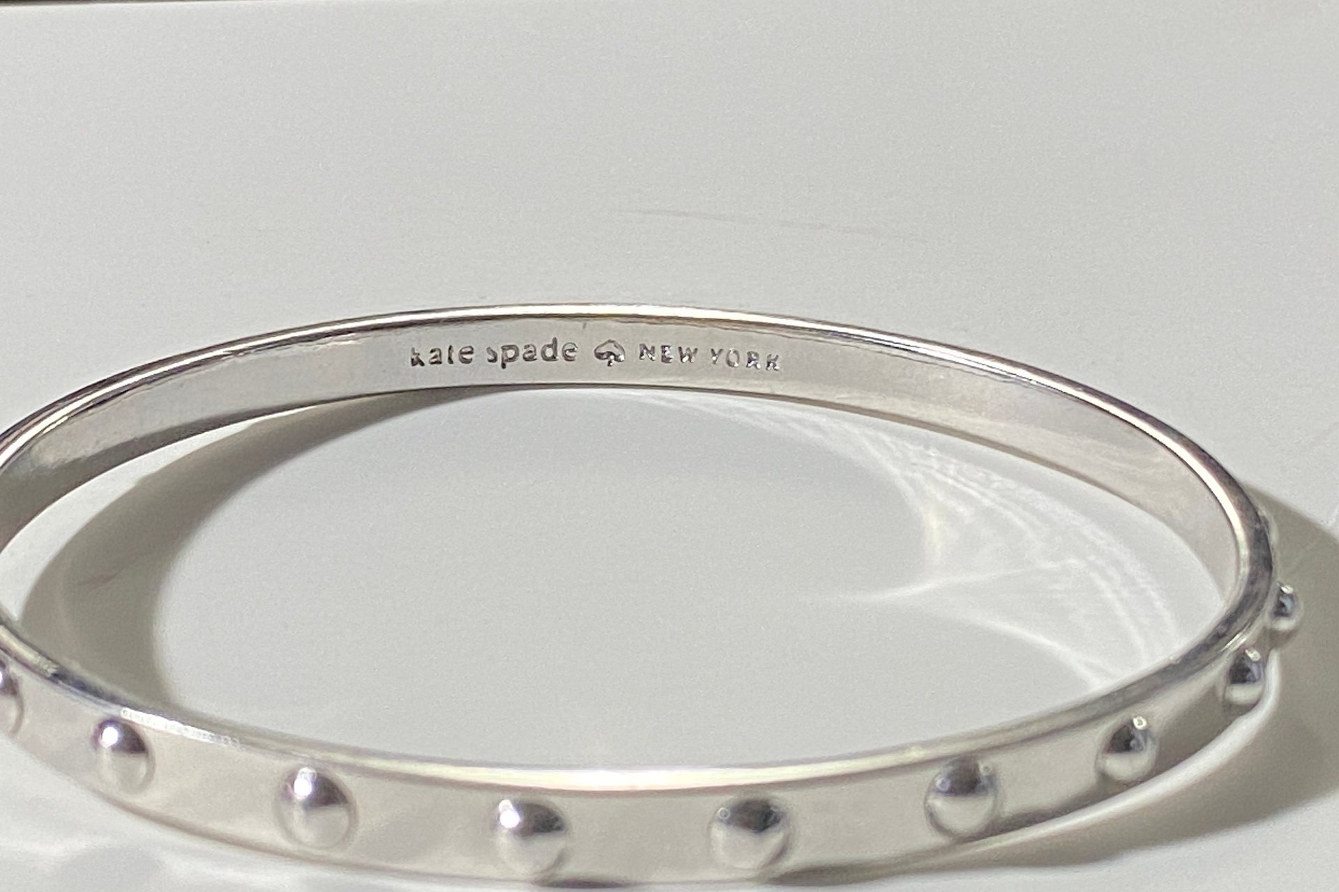 Kate Spade Silver tone studded bangle