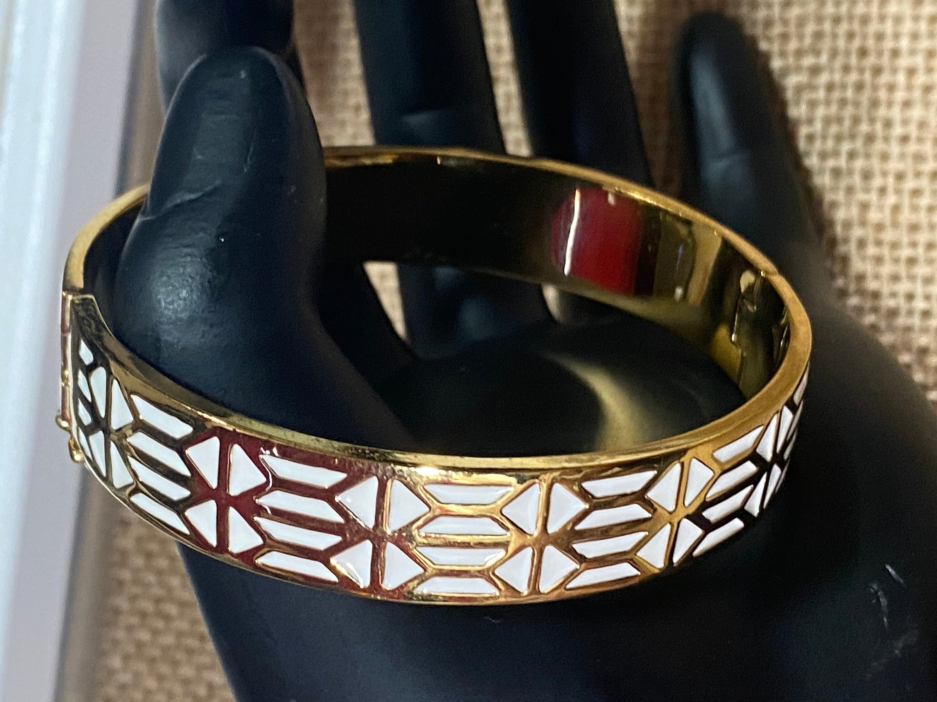 Gold tone with white enameled pattern Stella & Dot Bangle bracelet