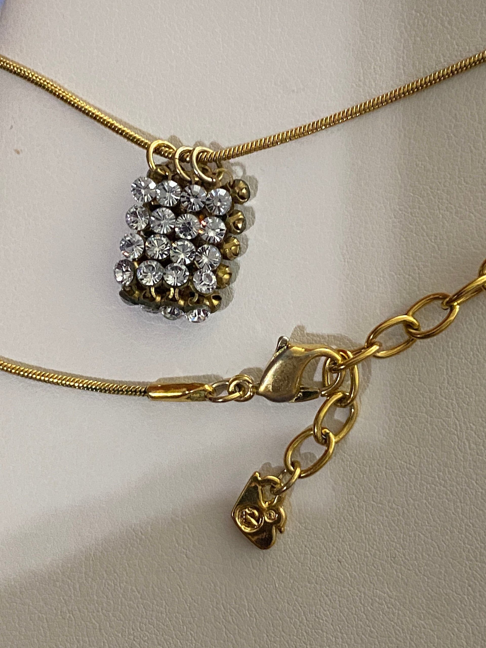 Swarovski crystals pendants signed on a gold tone Authentic