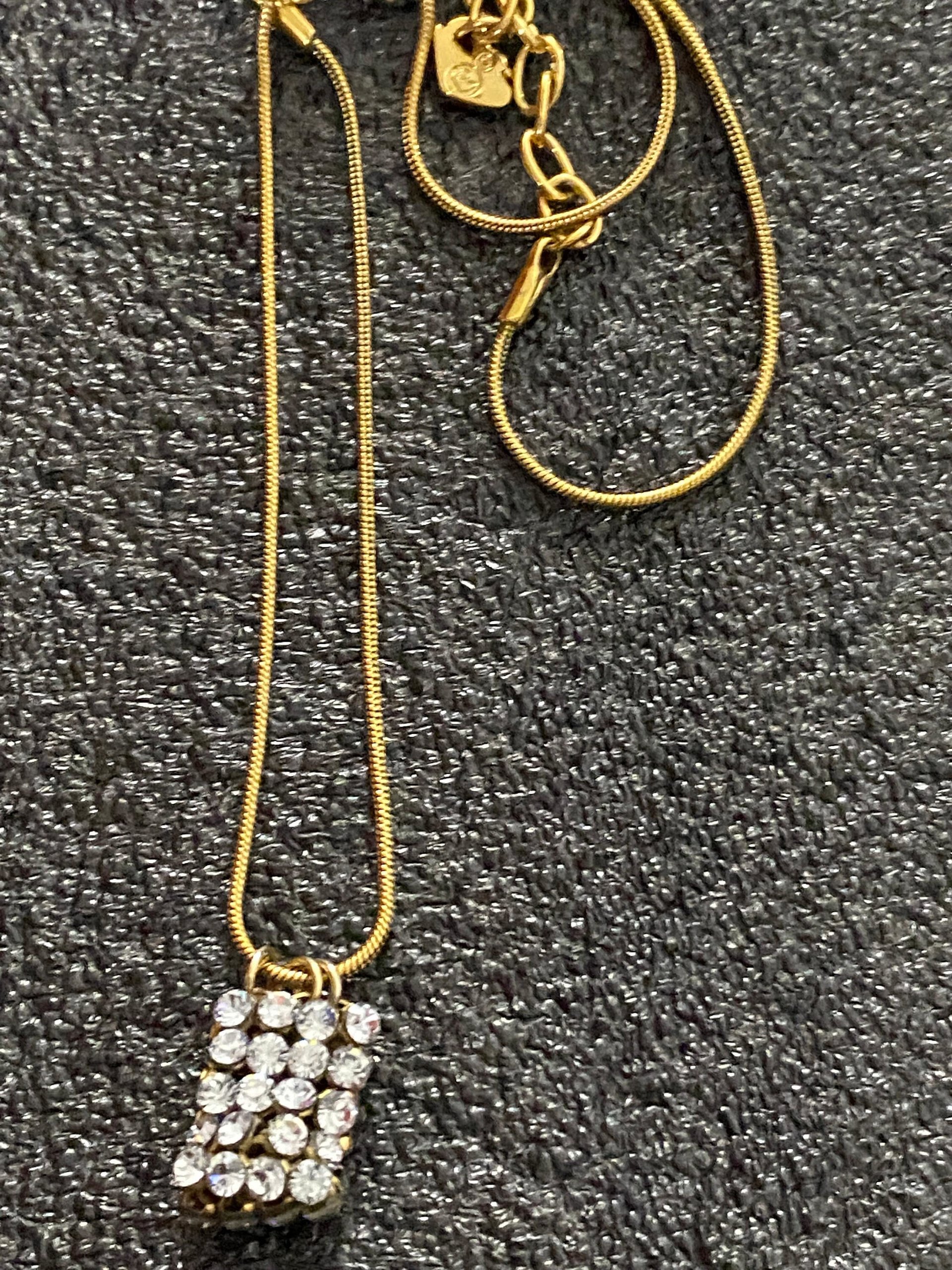 Swarovski crystals pendants signed on a gold tone Authentic
