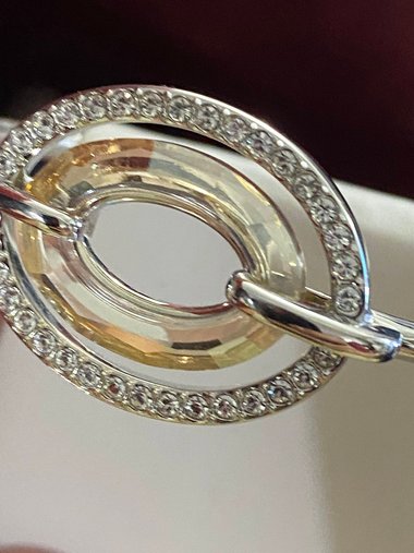 Authentic Swarovski Signed Logan Golden Shadow Bangle Bracelet and Rhodium-plated Circles Masquerade Pendant Pierced Earrings set.