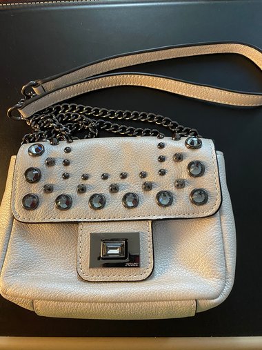Bejeweled  Juicy Couture white with silver tone chain and dark stone