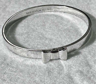 Silver tone Kate Spade “Take a Bow” bangle bracelet