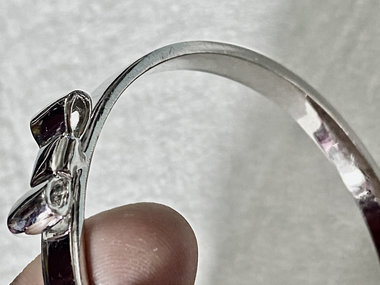 Silver tone Kate Spade “Take a Bow” bangle bracelet
