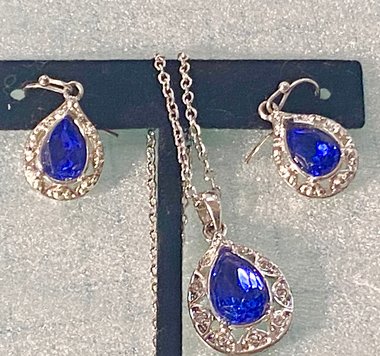 Vintage blue teardrop crystal halo NRT signed pendant on a silver chain with matching dangle earrings.