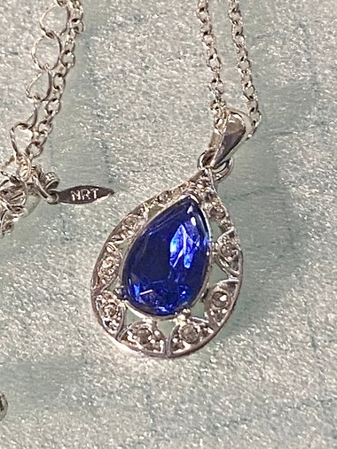 Vintage blue teardrop crystal halo NRT signed pendant on a silver chain with matching dangle earrings.