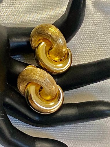 Vintage Gold tone 1980s Christian Dior high polished and textured clip on earrings.