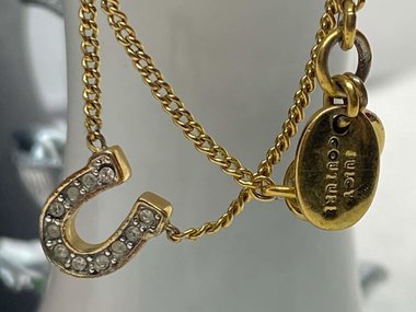 Rare authentic gold tone sparkly horseshoe  signed Juicy Couture