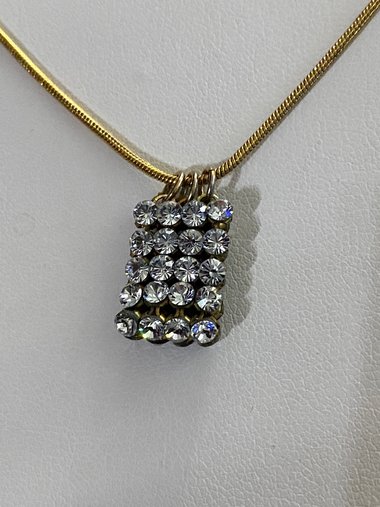 Swarovski crystals pendants signed on a gold tone Authentic